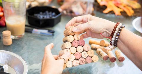 Close up of person working on wine cork craft