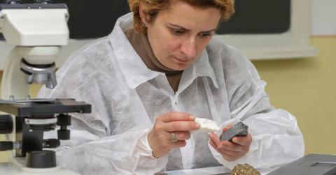 A geologist is testing a rock in the lab. (Representative Cover Image Source: Getty Images | Razvan)