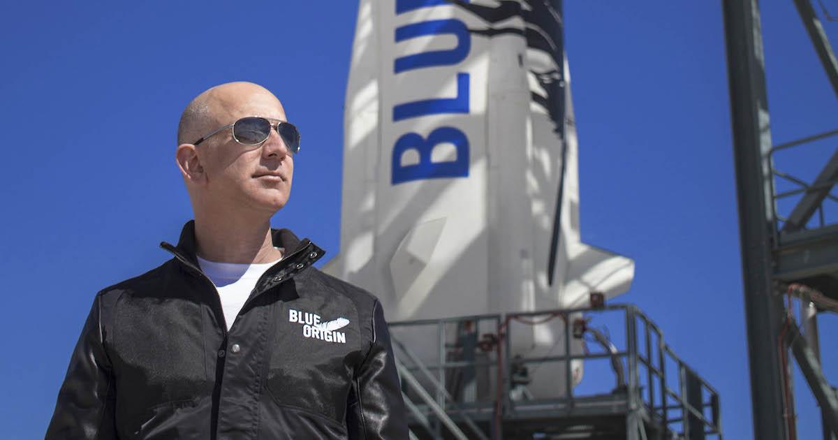 Jeff Bezos in front of Blue Origin rocket