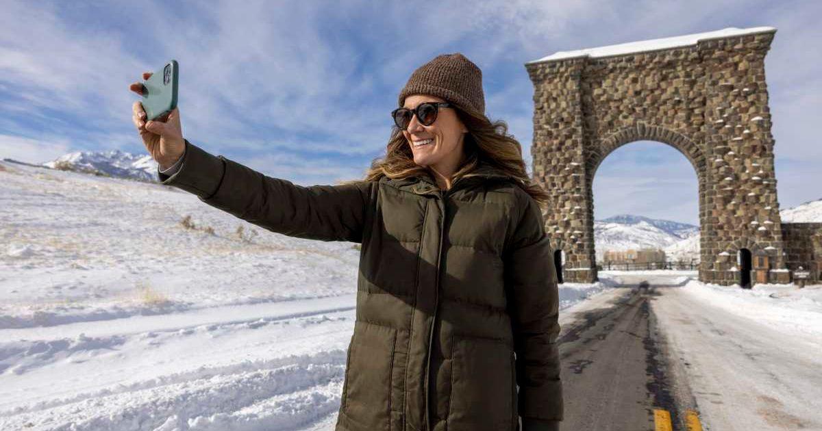 A visitor clicking a selfie in Yellowstone National Park during winter (Representative Cover Image Source: Getty Images | Jordan Siemens)