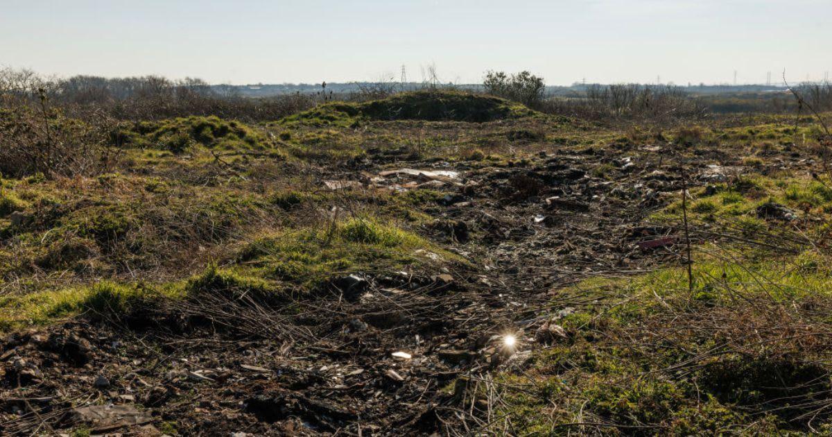 Debris is scattered all across the Arnolds Field landfill. (Cover Image Source: Getty Images | Photo By Dan Kitwood)