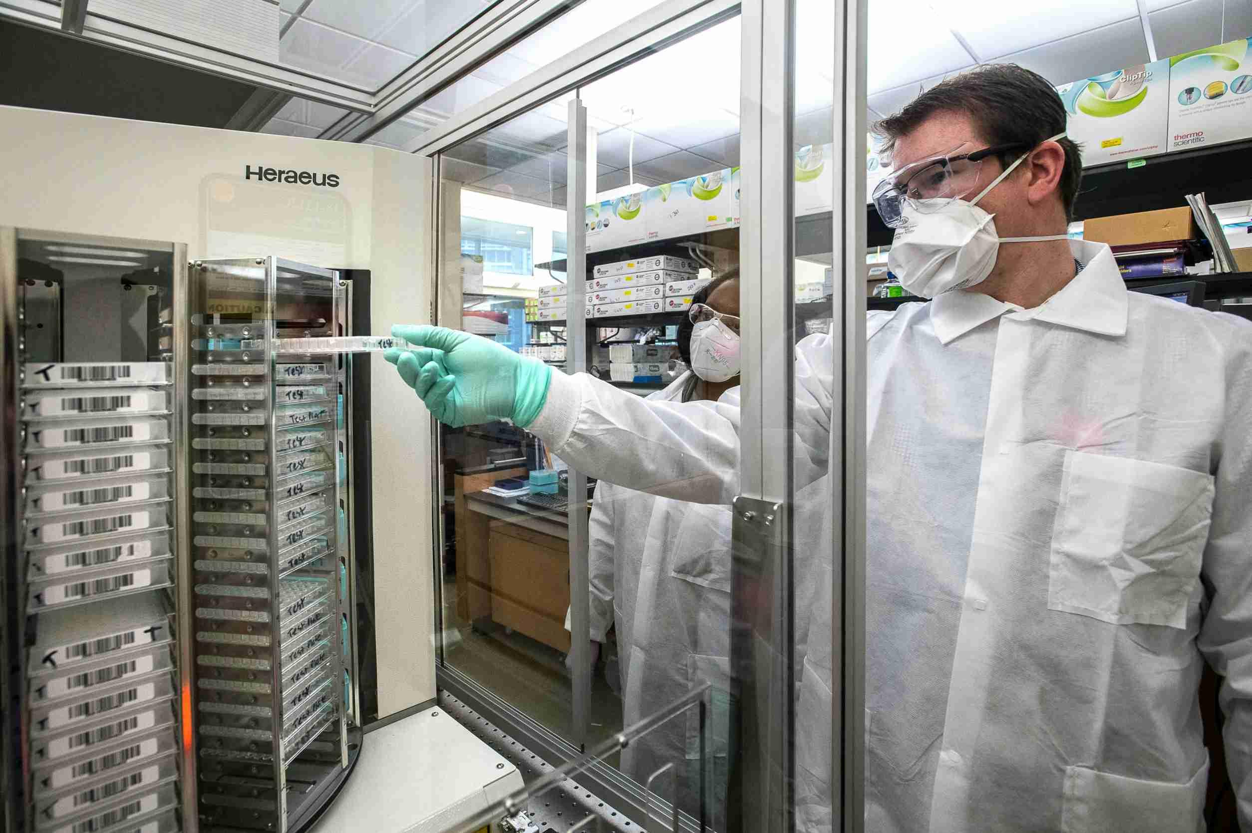 A CDC scientist views patient samples containing SARS-CoV-2 antibodies.