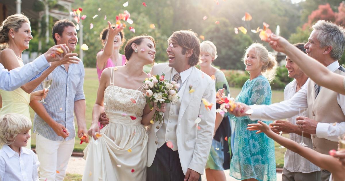 Newly married couple celebrating nuptials with guests. 