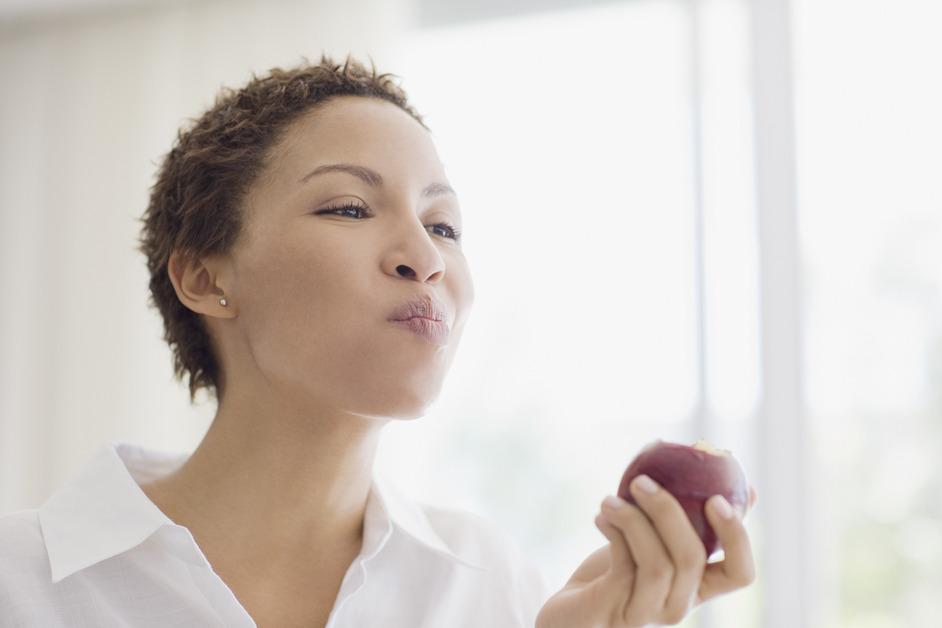 Woman eating apple