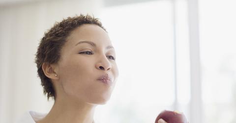 Woman eating apple
