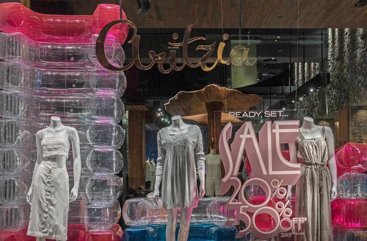 dresses on display in Aritzia store window