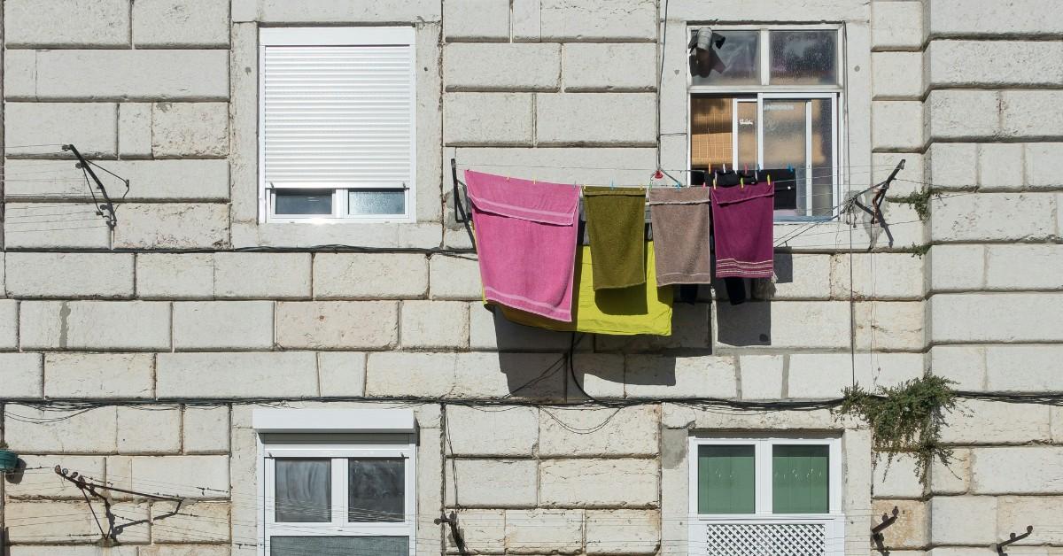 Bath towels hang outside to dry after being washed