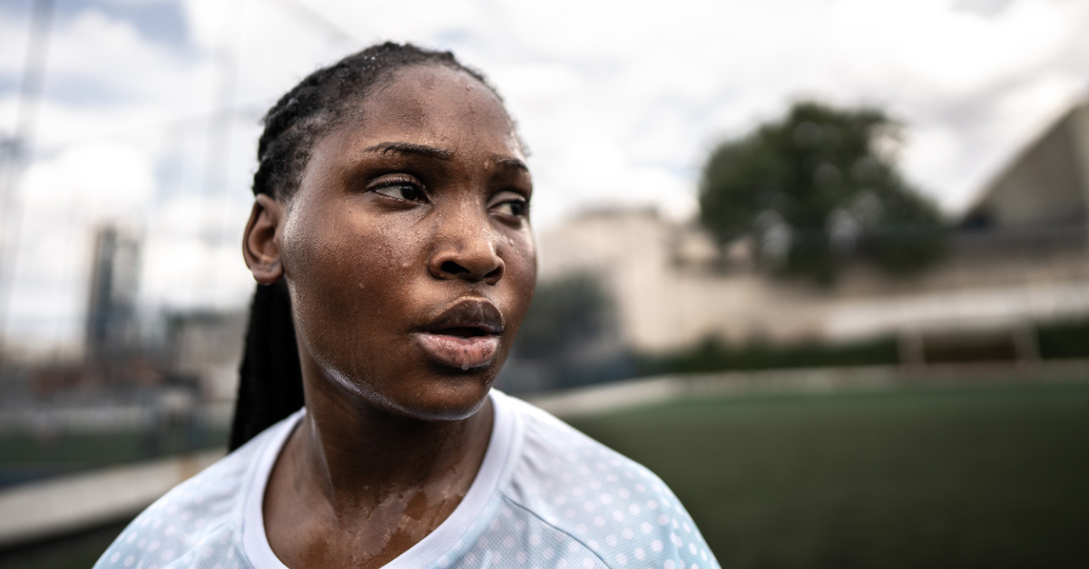 A profile of a woman dripping with sweat