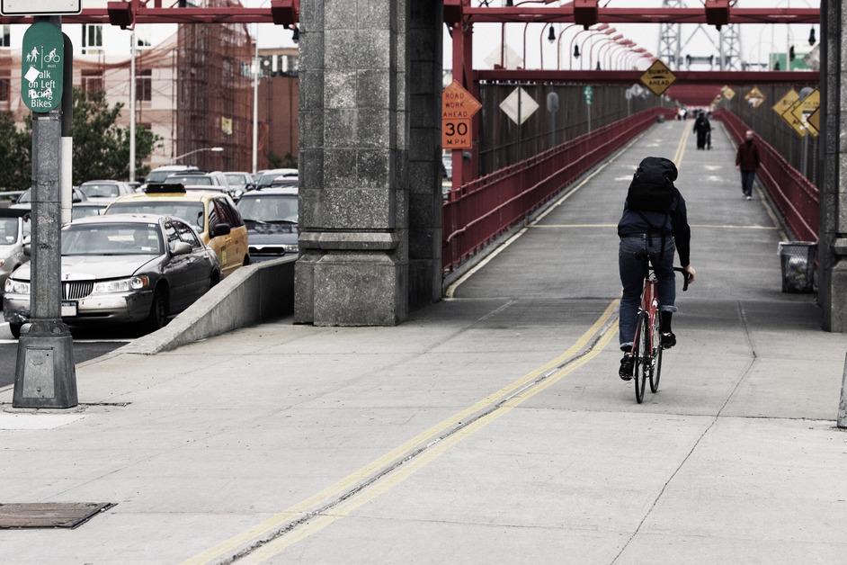 A person commuting on a bike in New York City. 