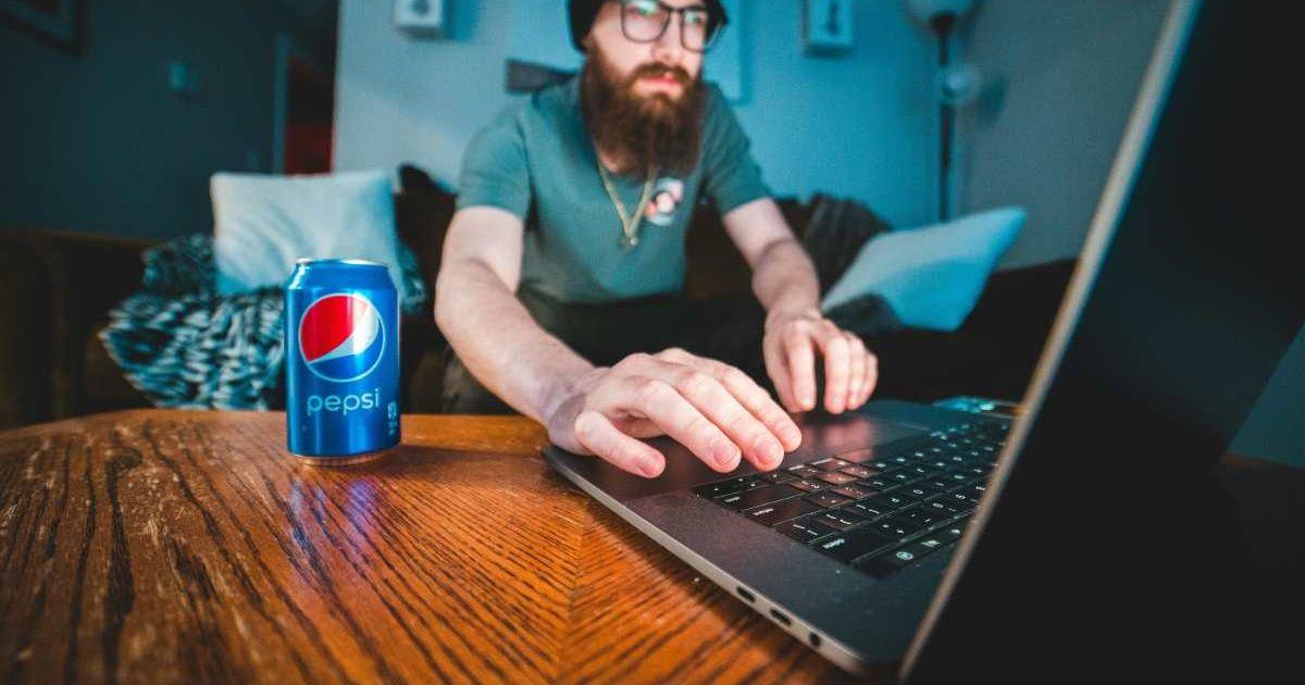 A person is consuming Pepsi while working. (Representative Cover Image Source: Pexels | Erik McClean)