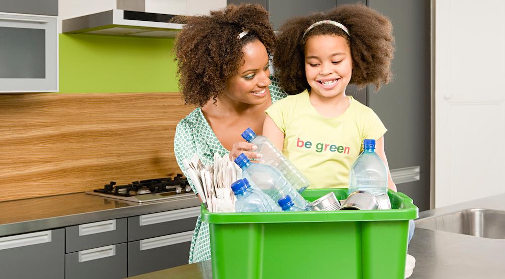 A Woman and Girl Recycling