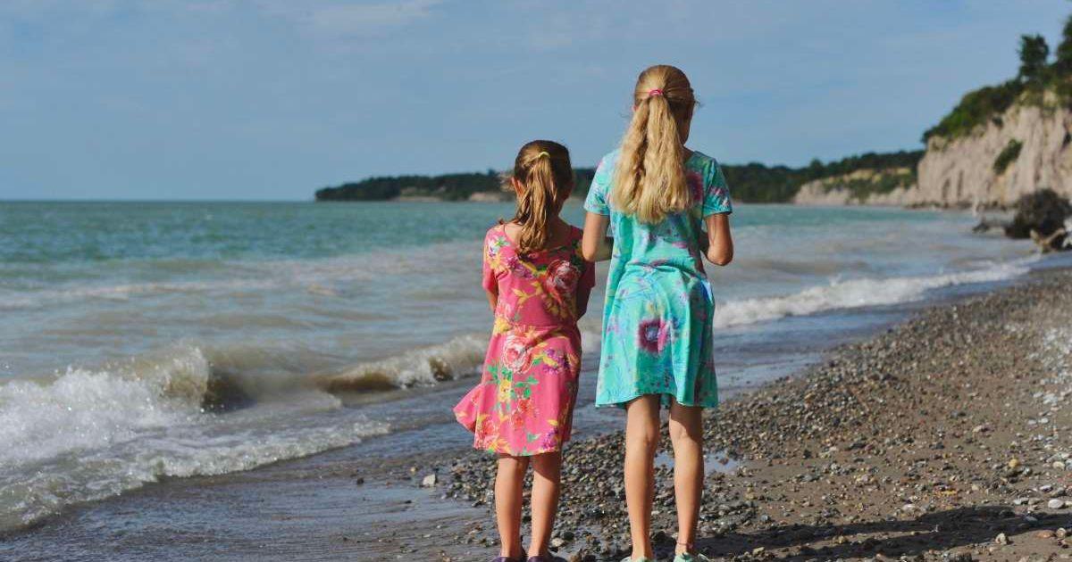 Two girls are standing on the shore of Lake Erie, watching waves crash and roll with the winds. (Representative Cover Image Source: Getty Images | 397167)