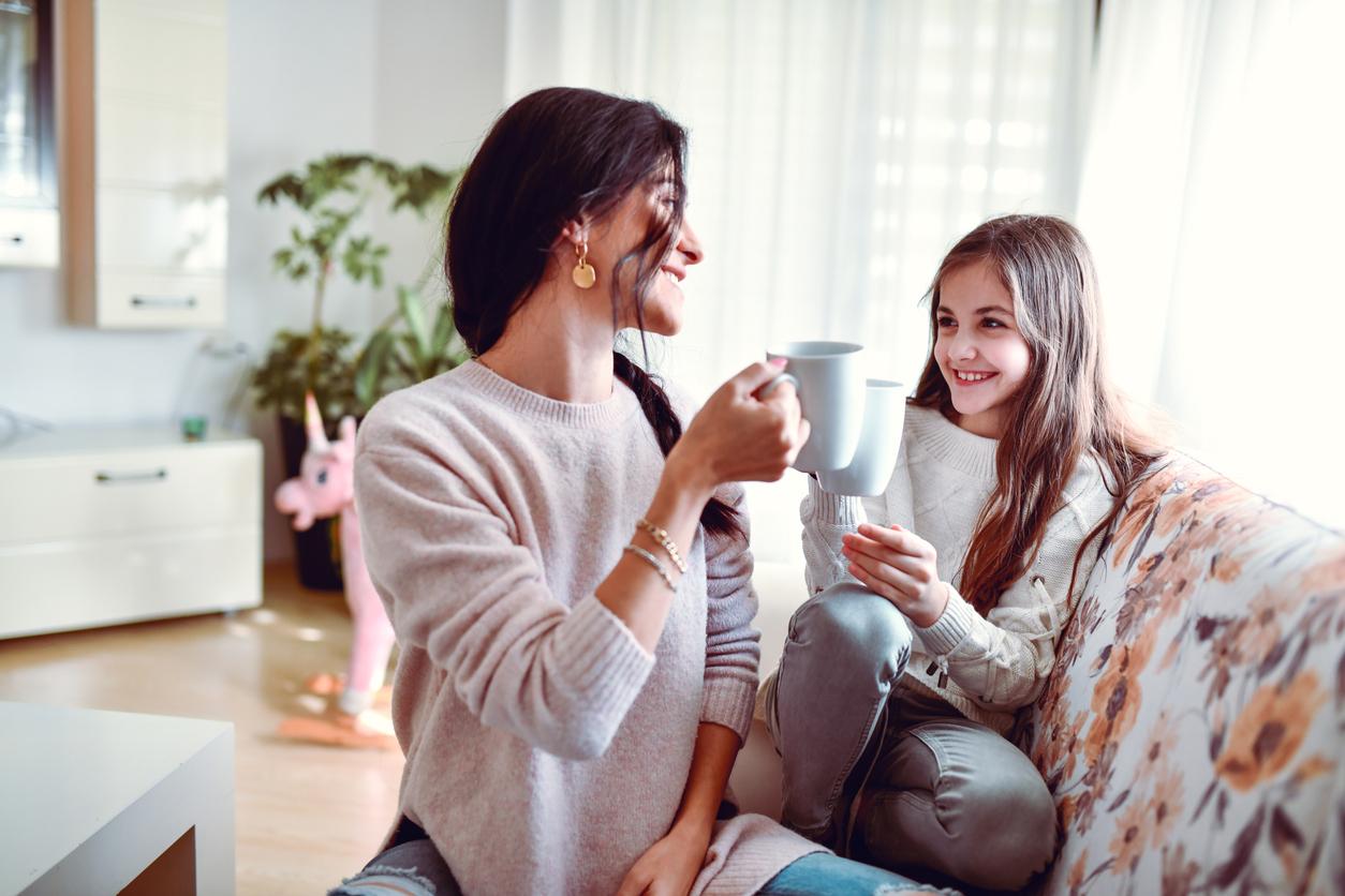 A smiling mother and daughter drink lemon gunpowder tea to support their overall wellness.