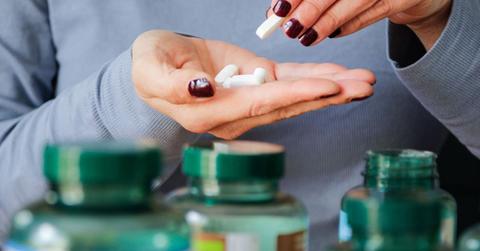 Woman taking vitamin supplements (Representative Cover Image Source: Getty Images | Kinga Krzeminska)