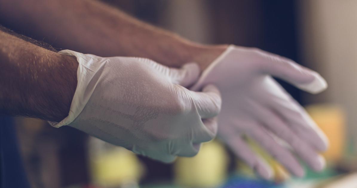 a disposable latex glove is worn by medical