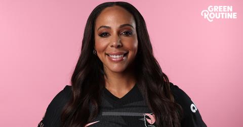 Headshot of soccer player Sydney Leroux of Angel City FC in front of a pink backround with the 'Green Matters' Green Routine logo layered on top