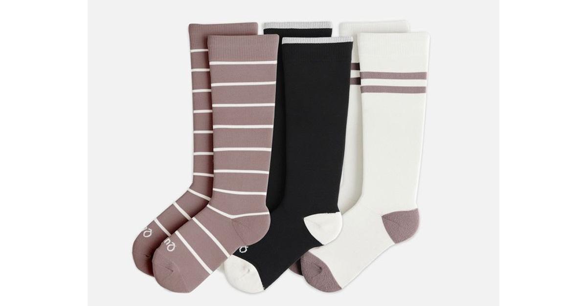 Three pairs of compression socks, solid and striped