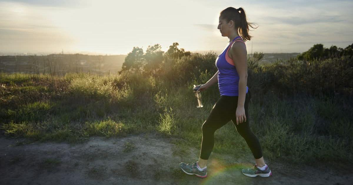 Woman goes for a morning walk holding a bottle of water in her hand. (Representative Cover Image Source: Getty Images | Patrik Giardino)