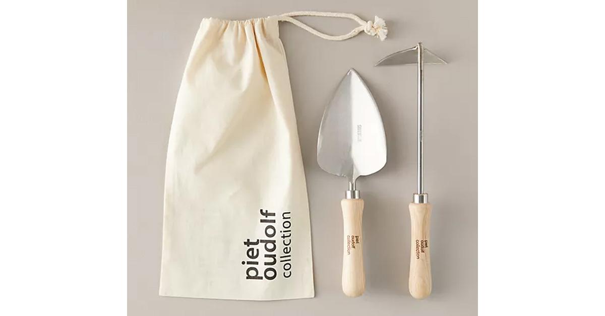 Sneeboer X Piet Oudolf Trowel + Hoe Gift Set with garden tools beside a canvas pouch.