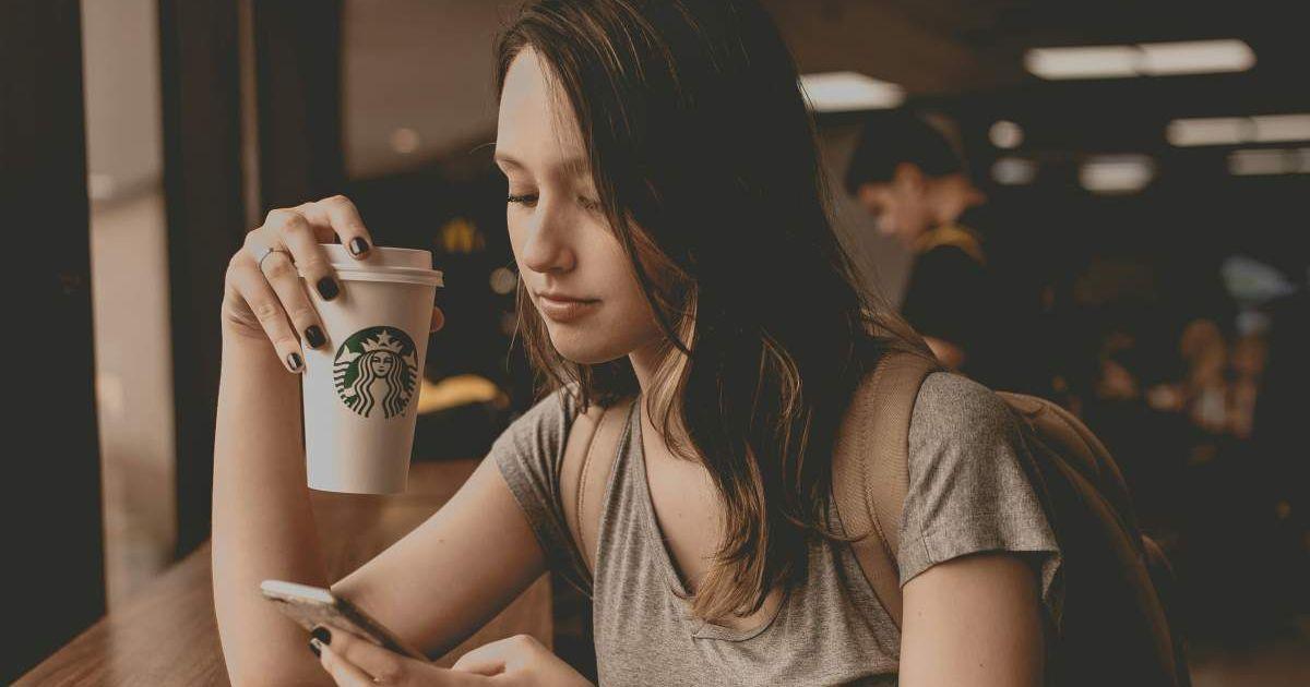 A woman sipping on her Starbucks frappuccino. (Representative Cover Image Source: Unsplash | Guilherme Stecanella 