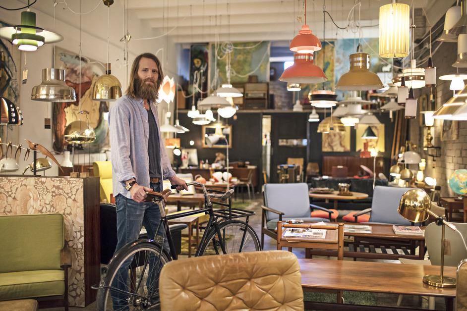 Male business owner standing in furniture store