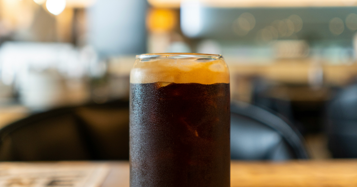 A closeup of a glass of ice cold soda
