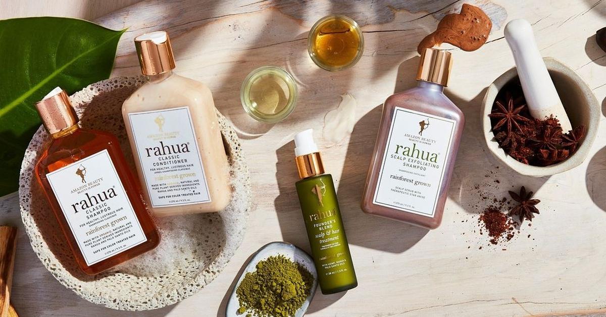 Product photos of Rahua shampoos and conditioners on a light wooden surface