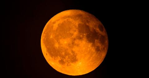 The moon is glowing orange in the sky. (Representative Cover Image Source: Getty Images | Sjo)