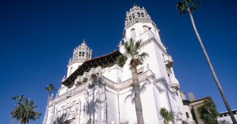 Hearst Castle photographed from below, on a sunny day, surrounded by palm trees, taken circa. June 20, 1984