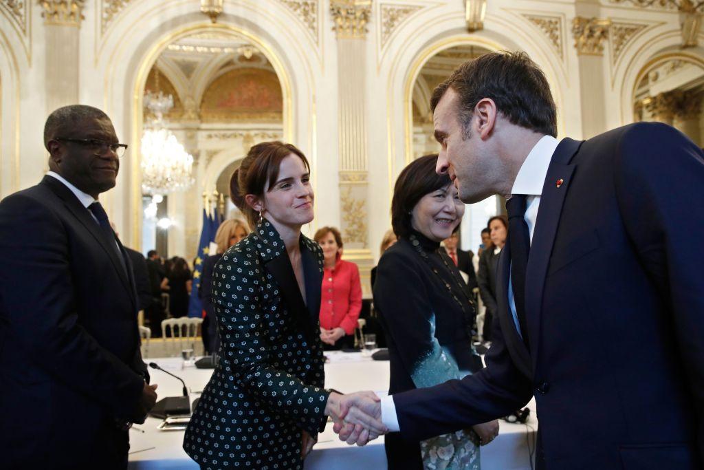 Emma Watson shakes the hand of Emmanuel Macron during the G7 Gender Equality Advisory Council in Paris in Feb. 2019.