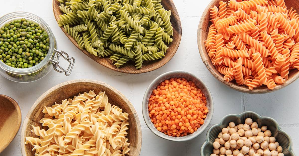 A variety of fusilli pasta made from different types of legumes, including lentils and chickpeas