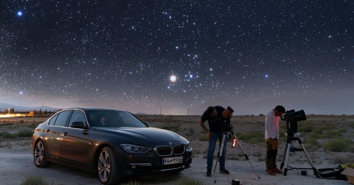Two people set up telescopes next to their cars