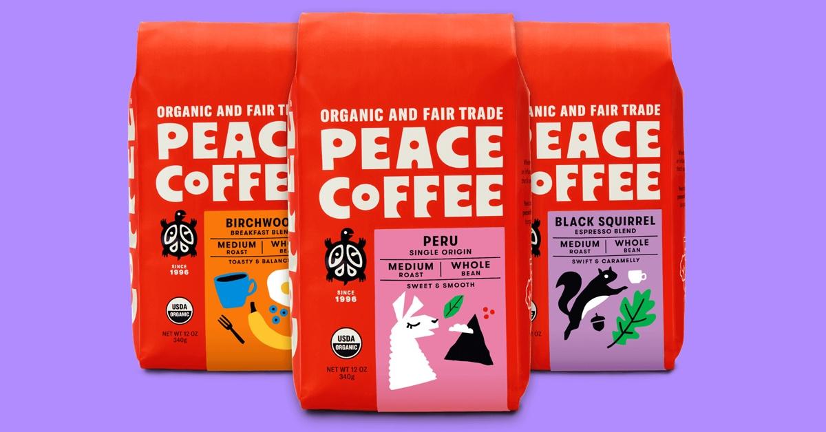 Three red bags of Peace Coffee on a lavender background.