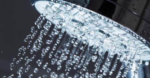 A shower head running water.