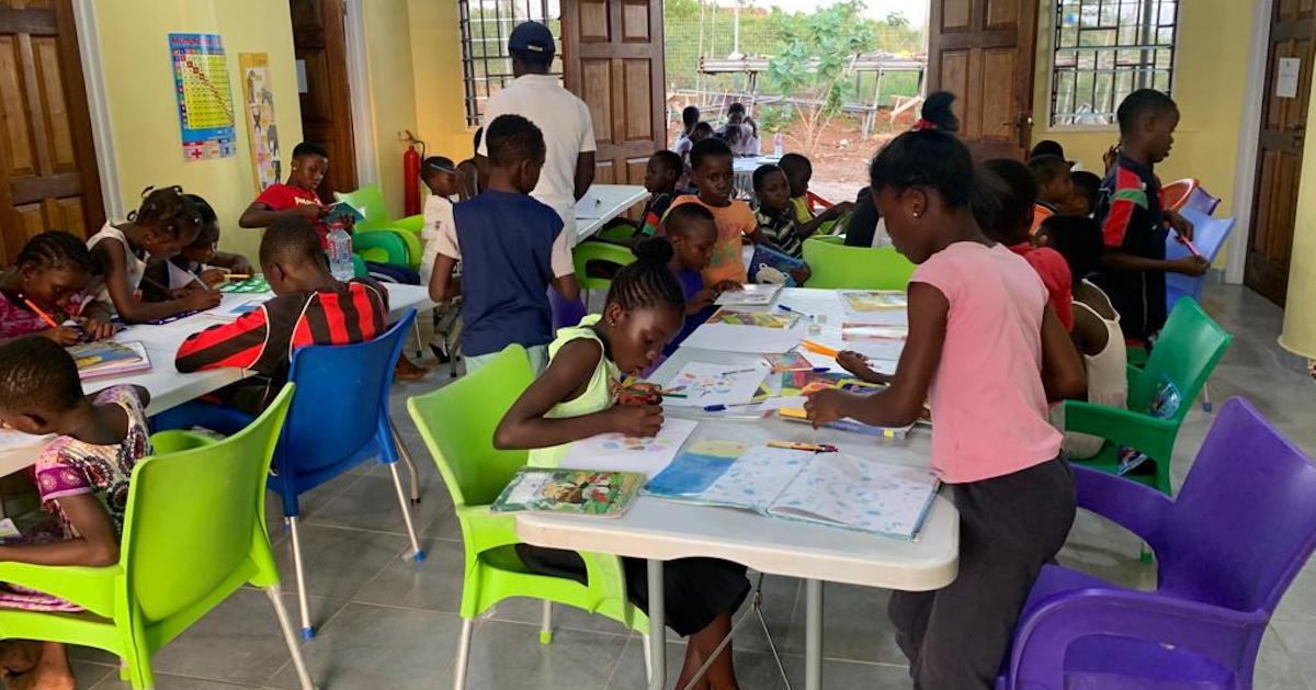 Children work at tables at the Sankofa Centre