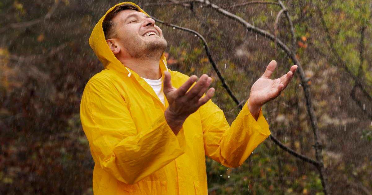 Man having a blissful moment enjoying and collecting rainwater (Representative Cover Image Source: Freepik)