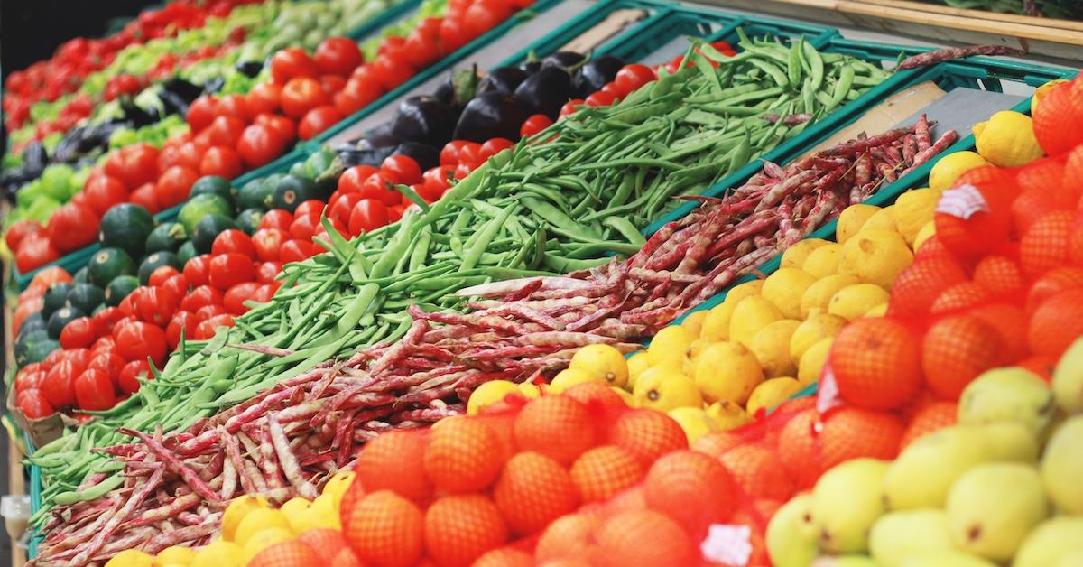 Rows of all different vegetables on display in a supermarket