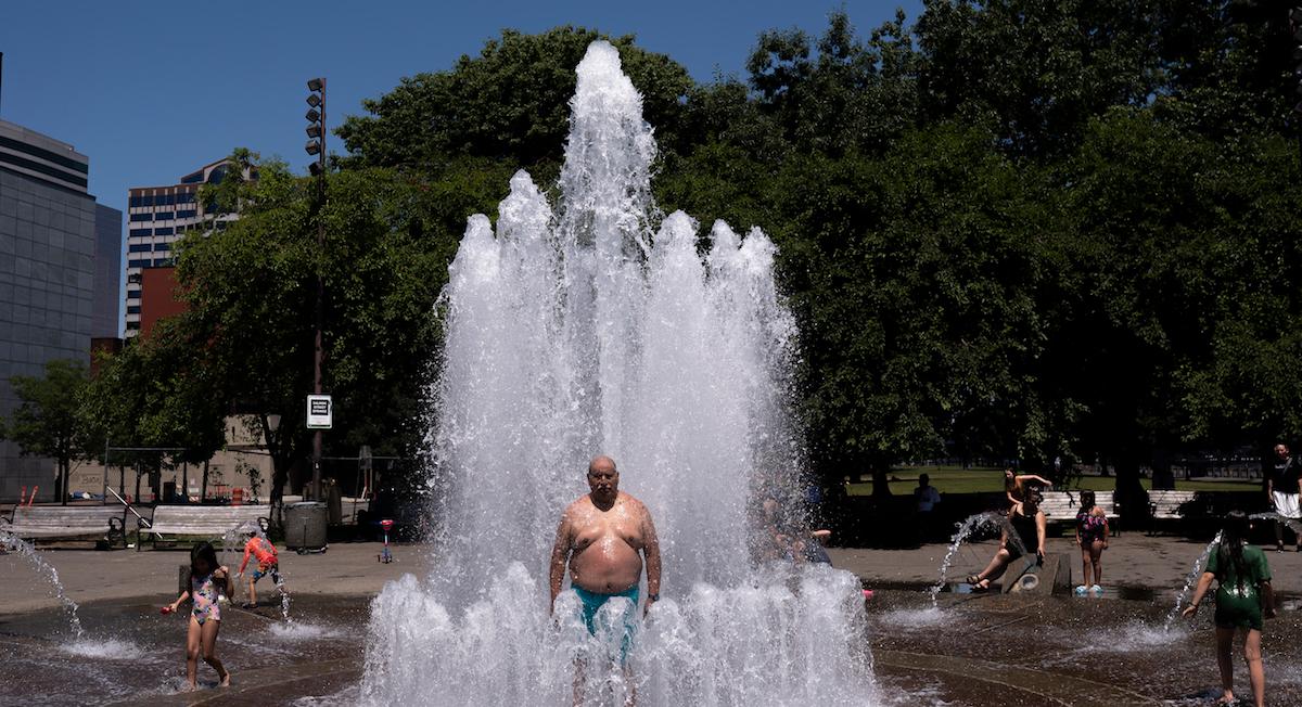 Man cooling off in fountain