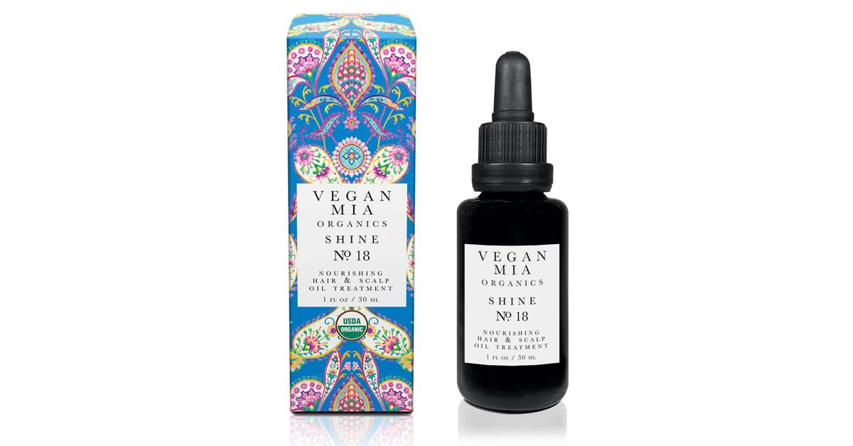 Vegan Mia Organics Shine No. 18 Nourishing Hair and Scalp Oil Treatment in a black bottle with blue paisley box beside it.