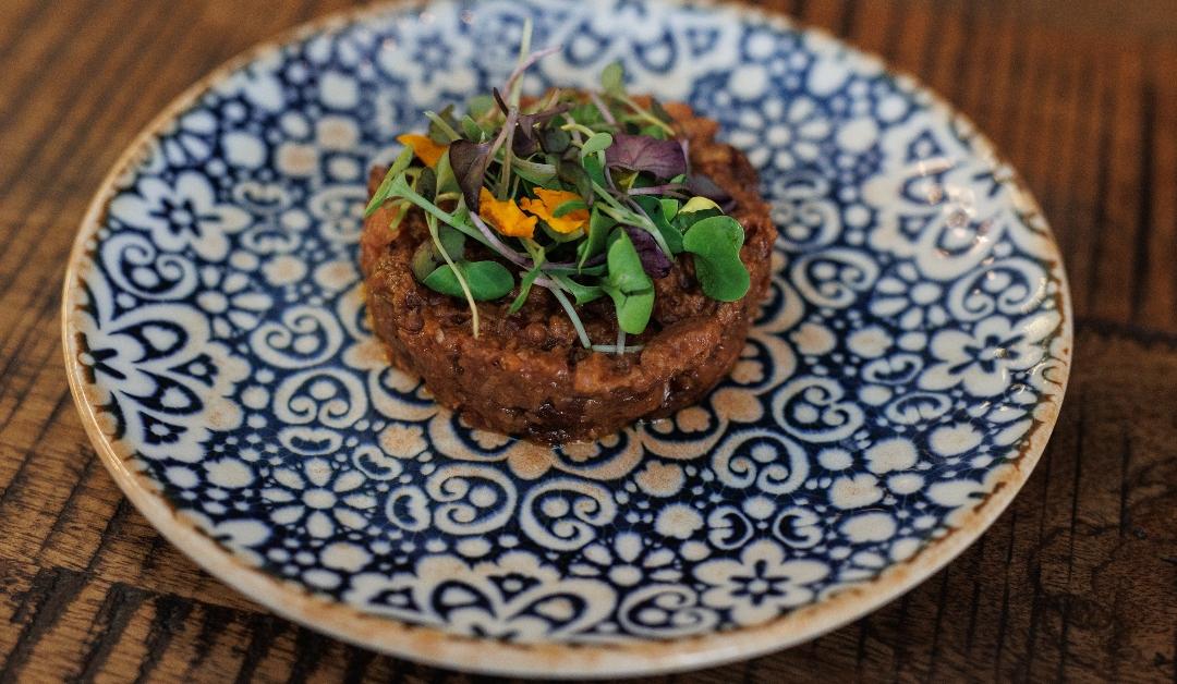 Tapa Bobotie, a vegan meatloaf and bread typical of South Africa, on a plate 