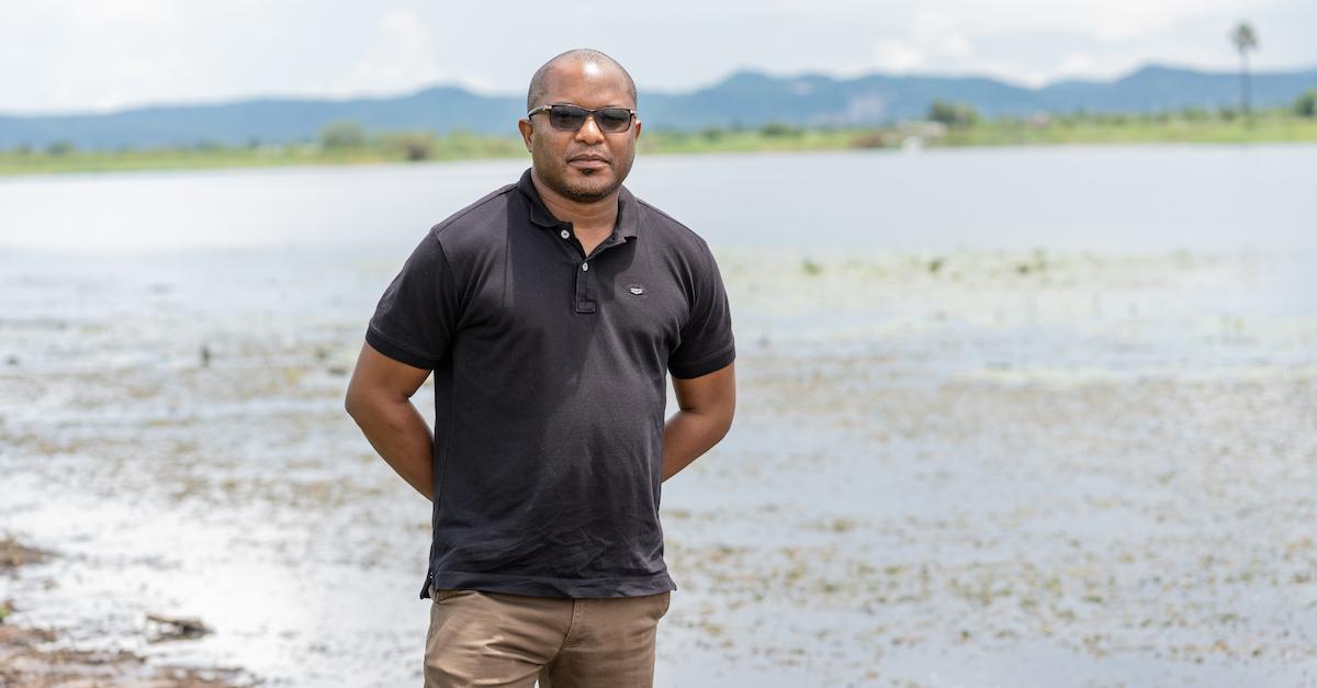 Chilekwa Mumba stands on the beach.