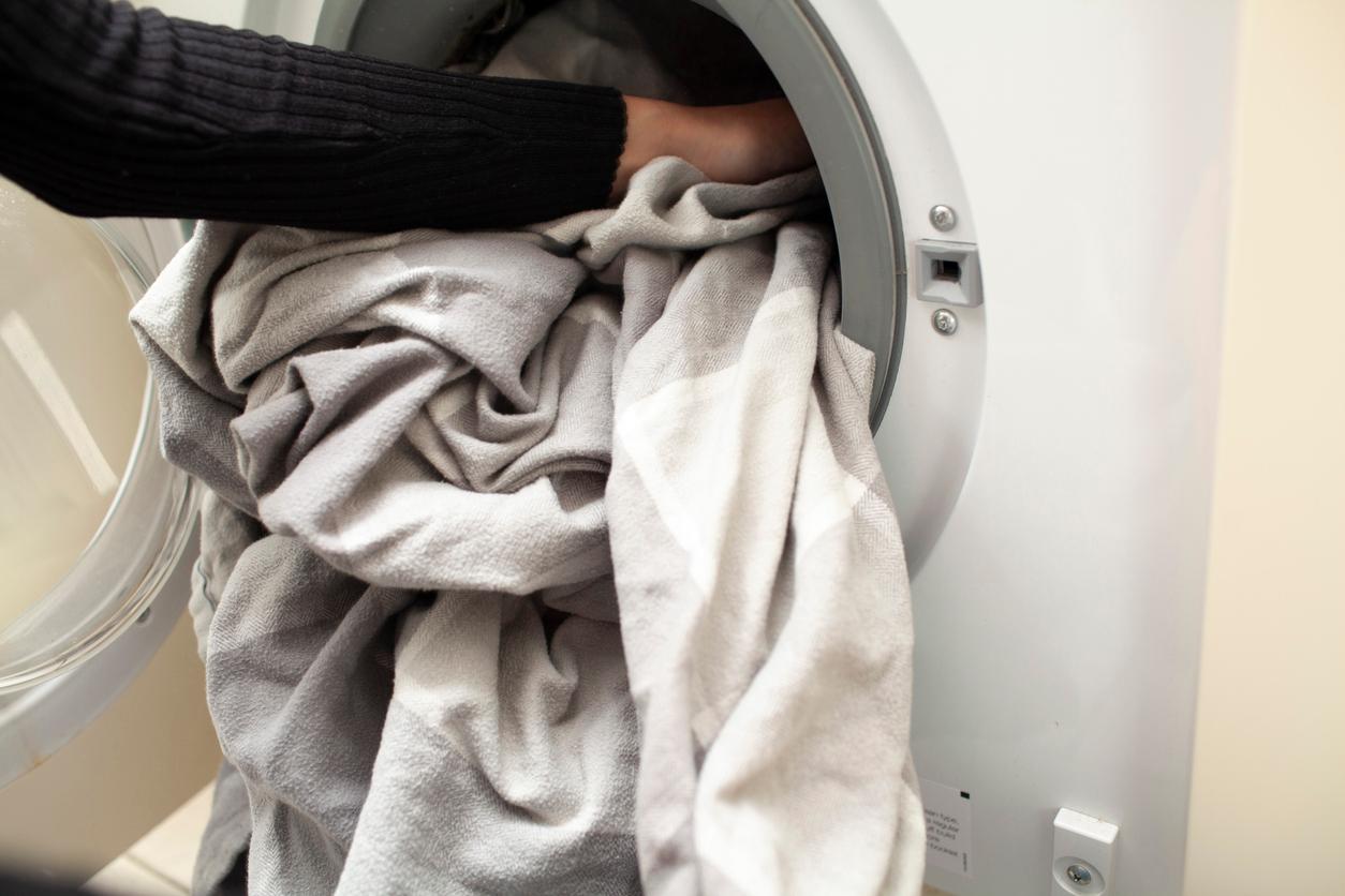 Sheets being put into a dryer.