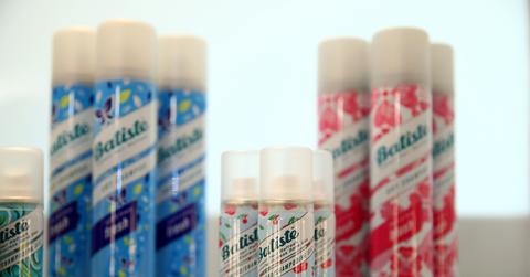 Three sets of three Batiste dry shampoos with a travel size set in the front.