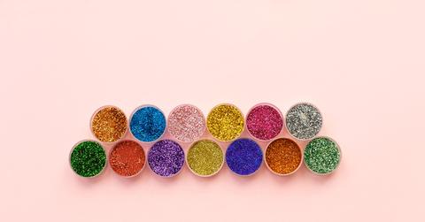 Stock photo of regular glitter in containers.
