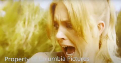 Screenshot of behind-the-scenes footage of Sydney Sweeney being attacked by a huntsman spider while filming 2023's 'Anyone But You'