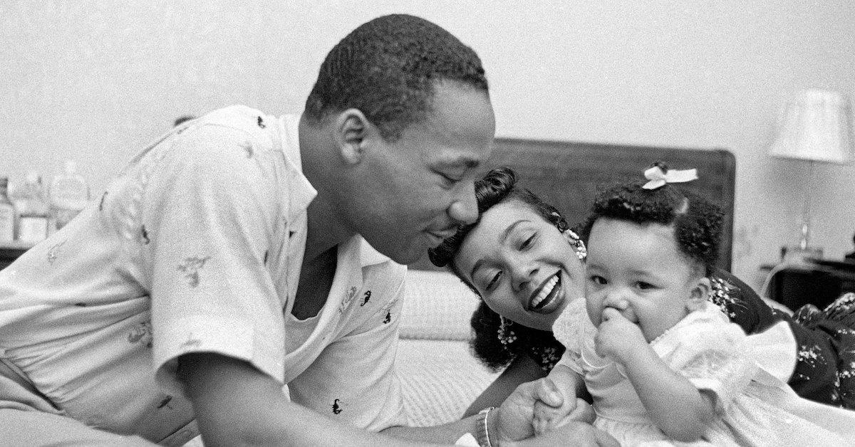 Martin Luther King, Jr., Coretta Scott King, and their baby in a black-and-white image.