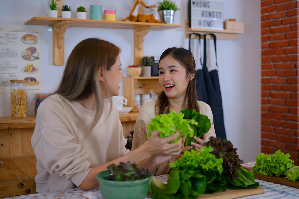 Asian medical and nutritional experts have sung the praises of plants as medicine, as depicted here with two friends discussing the nutritional value of leafy greens.