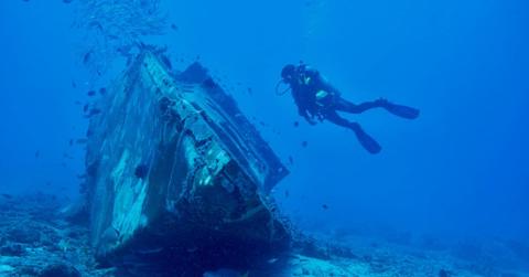 A diver exploring an old shipwreck at the bottom of the sea. (Representative Cover Image Source: Pexels | Pascal Ingelrest)