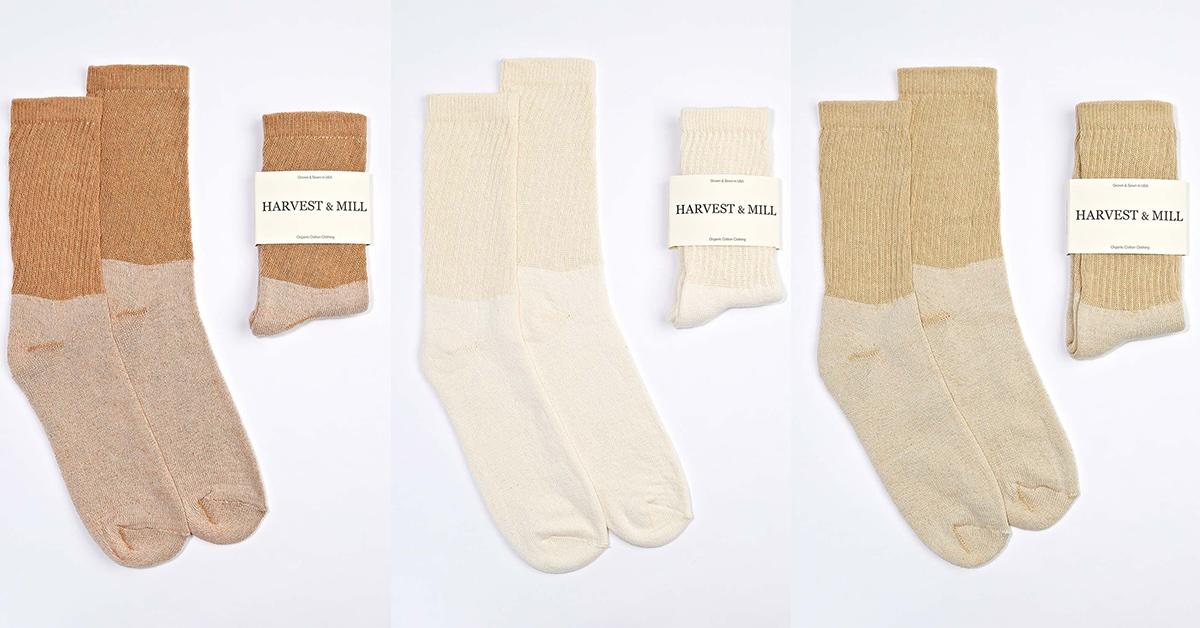 Various pairs of Harvest & Mill socks on white surface