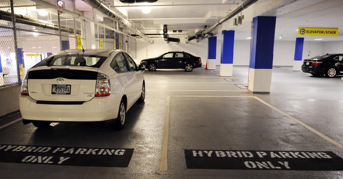 Hybrid parking only spots in a parking garage. 